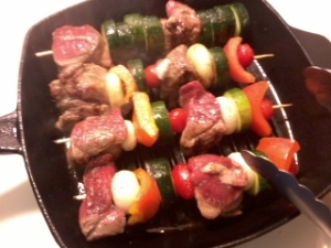 grilling the skewers, turning them over 1/4 way once every five minutes